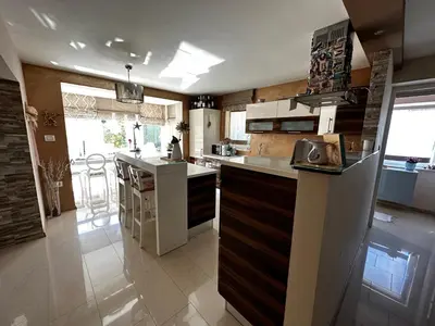 a kitchen with a sink and a counter top at Apartment HOME SWEET HOME in Zgornje Škofije