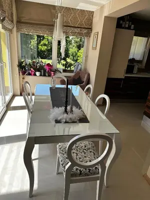 a dining room table with a laptop on top of it at Apartment HOME SWEET HOME in Zgornje Škofije