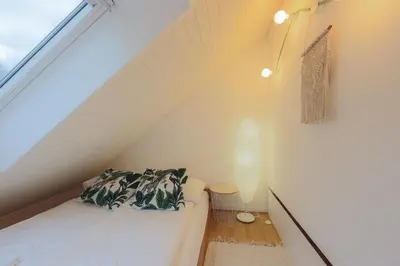 a room with a white couch and a window at Apartma Pehta in Kranjska Gora