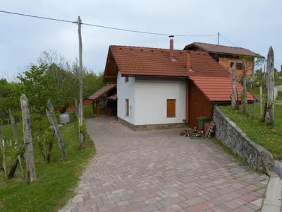 a small house with a brick walkway in front of it at Holiday home in Dragatus - Kranjska (Krain) 50798 in Dragatuš