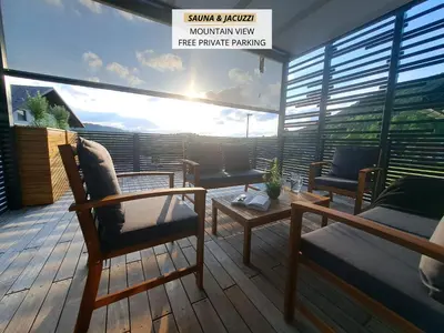 a balcony with two chairs and a table on a deck at S&B's RETREAT in Godovič
