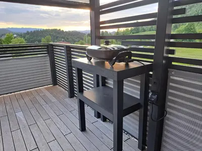 a grill sitting on a table on a balcony at S&B's RETREAT in Godovič