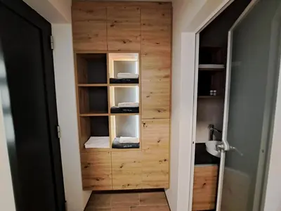 a room with a closet with wooden walls at S&B's RETREAT in Godovič