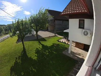 an aerial view of a yard with a house at Slivnisko Jezero Hisa in Veliki Rakitovec