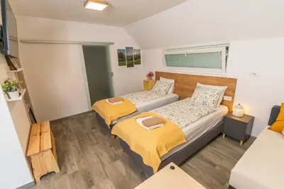 a bedroom with two beds in a room at Studio Maria with Free Parking in Bohinj