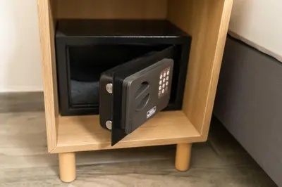 a microwave oven in a small wooden cabinet at Studio Maria with Free Parking in Bohinj