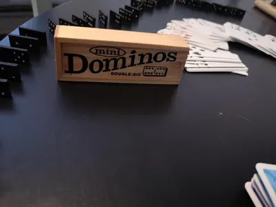 a box of dominoes sitting on top of a table at Apartma Oreh Vila Ziba in Bohinj