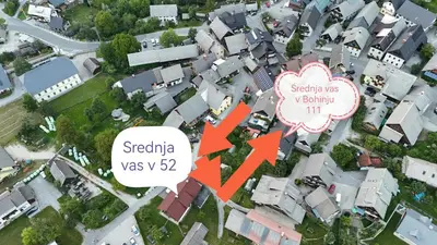 a map of a suburb with a red arrow pointing to a house at Apartma Oreh Vila Ziba in Bohinj