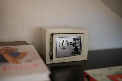a small switch on a table next to a book at Hiša Perla in Boštanj