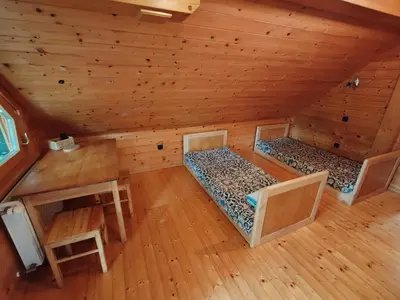 an overhead view of a log cabin with two beds at Room Janez in Preddvor
