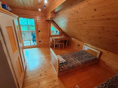 an overhead view of a bedroom in a log cabin at Room Janez in Preddvor