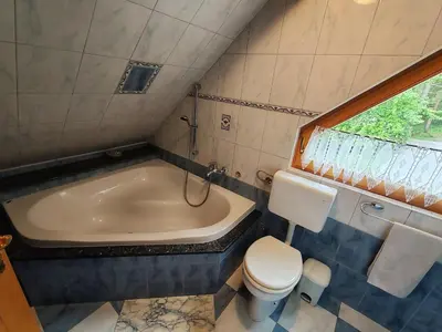 a bathroom with a tub and a toilet and a sink at Room Janez in Preddvor