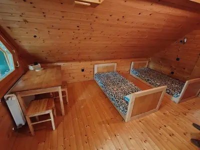 an overhead view of a room with two beds in a cabin at Room Janez in Preddvor