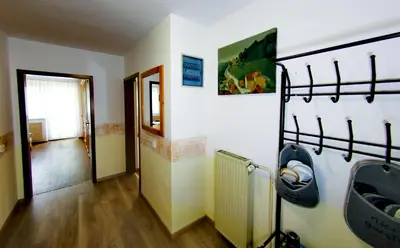 a room with two bunk beds and a hallway at Aparthouse Bohinj in Bohinj