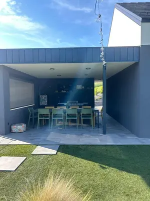 an open patio with a table and chairs at Midnight Villa in Cerkvenjak