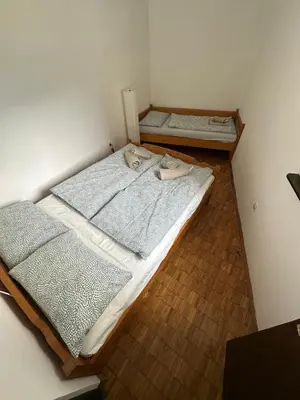 an overhead view of two beds in a room at Apartma Marjeta in Bovec