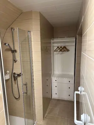 a shower with a glass door in a bathroom at Bijol Apartments in Bled