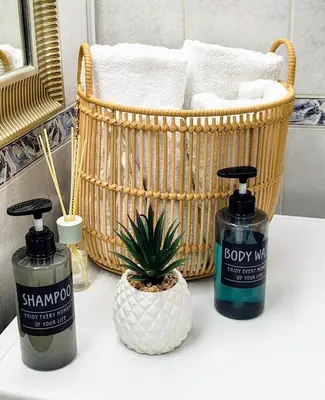 a bathroom with two bottles of soap and a plant at Relax apartment Ljubljana in Ljubljana
