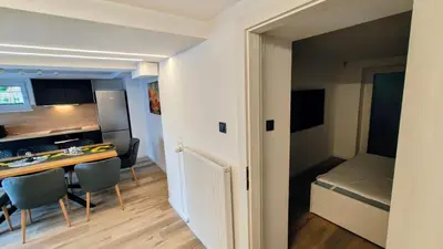 a small kitchen and dining room with a table and chairs at Relax apartment Ljubljana in Ljubljana