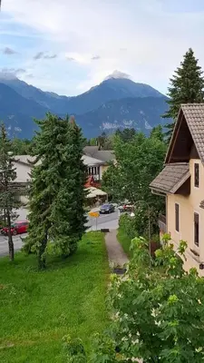 a view of a yard with mountains in the background at Apartma Harmonia with parking in Bled
