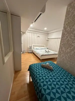 a bedroom with two beds in a room at Granada Rooms in Ljubljana
