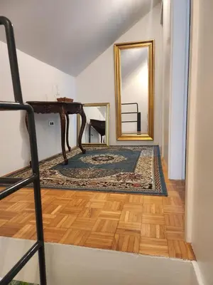 a room with a dressing table and a mirror at Avrora House FREE parking in OLD TOWN in Ljubljana