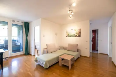 a living room with a couch and a table at The Elegant Retreat in Ljubljana