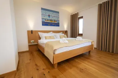 a bedroom with a large bed in a room at BRIC Wine & Relax in Vogrsko