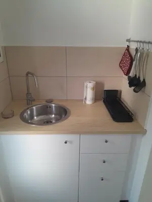 a kitchen counter with a sink and a keyboard at apartma pika in Šempeter pri Gorici