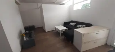 a small living room with a couch and a table at apartma pika in Šempeter pri Gorici