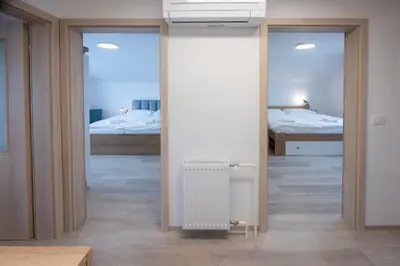 a room with a radiator and a room with two beds at Apartment Erika in Bled