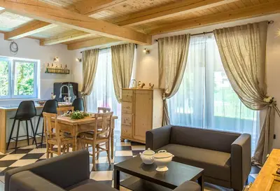 a living room with a couch and a table at Villa Loren in Avber