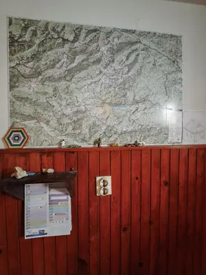 a large map on the wall of a room at Hikers Hut Hišar in Podbrdo