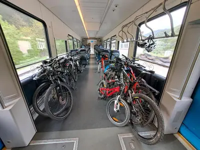a group of bikes parked in a train car at Hikers Hut Hišar in Podbrdo