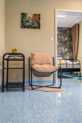 a room with two beds and a pillow on a chair at Diamond dream in Ptuj