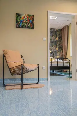 a hospital room with two beds and a painting on the wall at Diamond dream in Ptuj