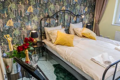 a bedroom with a bed with a floral wallpaper at Diamond dream in Ptuj