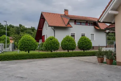 a white house with trees in front of it at Diamond dream in Ptuj
