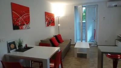 a living room with a couch and a table at Boutique Apartments in Ljubljana