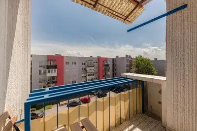 a balcony with a view of a parking lot at Cosy and Bright Apartment in Ljubljana