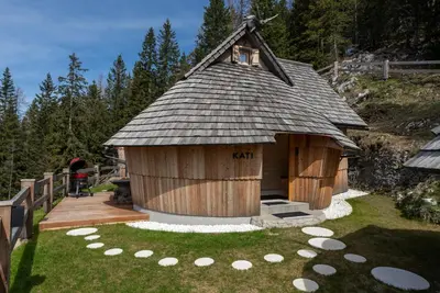 a large wooden dog house with a roof at Luxury Chalet & Sauna Kati - Velika Planina - I Feel Alps in Stahovica