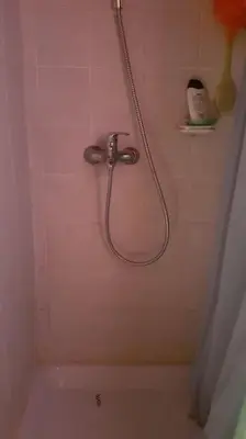 a shower in a bathroom with a bath tub at Chalet Kujavnk in Kranj