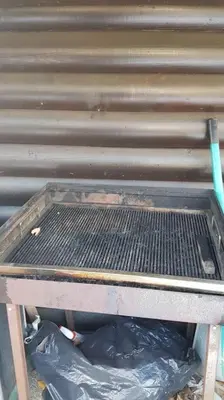 a metal bench with a trash bag under it at Chalet Kujavnk in Kranj
