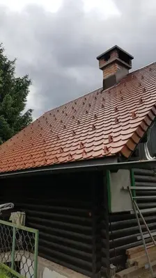 a building with a red roof with a chimney on it at Chalet Kujavnk in Kranj