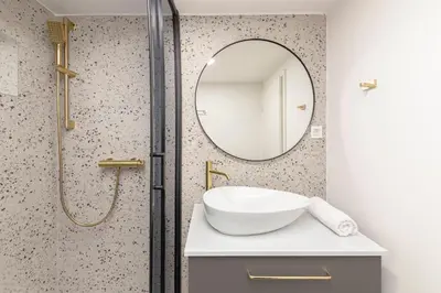 a bathroom with a sink and a mirror at Studio Nensi in Ljubljana