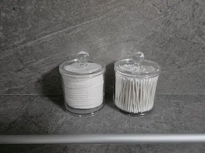 two glass containers sitting on top of a table at Apartma Bistr'ca in Bohinj