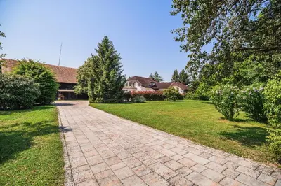 a brick driveway in front of a house at Holiday Home Slavc with 4 Bedrooms in Brežice