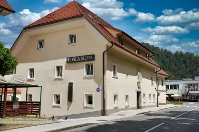 a building with a sign on the side of it at Vila Sofia in Tržič