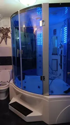 a blue shower in a bathroom with a toilet at Hiša Piber in Bled
