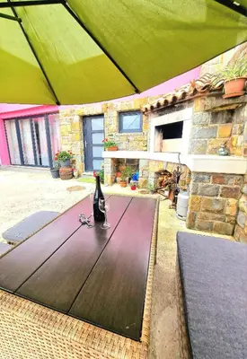 a ping pong table in front of a building at Mediteran Apartments in Koper